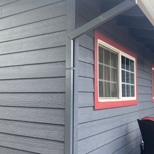 grey siding with red accents